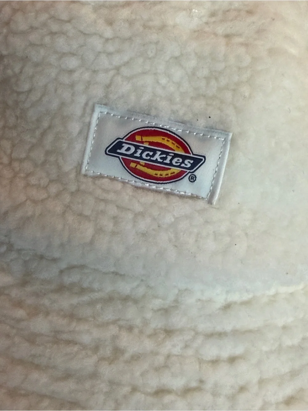 Dickies Red Chute sherpa fleece bucket hat in a warm cream/ecru color. Soft fuzz